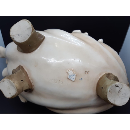 27 - An impressive 19th century porcelain centre bowl with scalloped edge, horse head front, tri-footed b... 