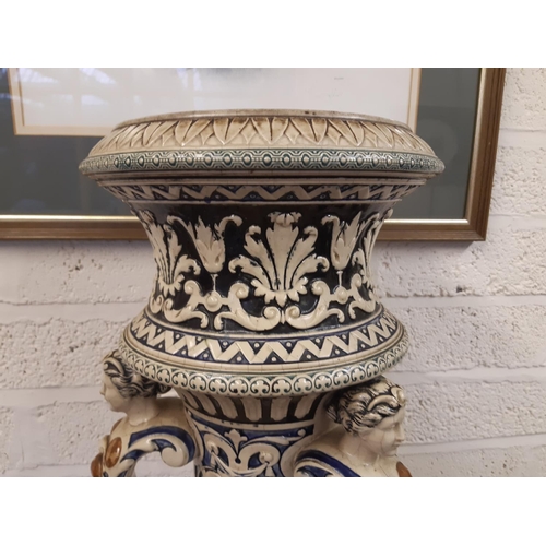 33 - A heavy stoneware salt glazed English Majolica jardinière stand with lion head acanthus leaf and swa... 