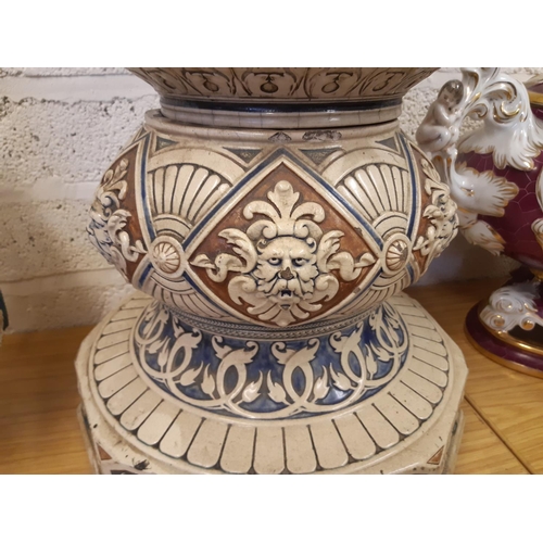 33 - A heavy stoneware salt glazed English Majolica jardinière stand with lion head acanthus leaf and swa... 