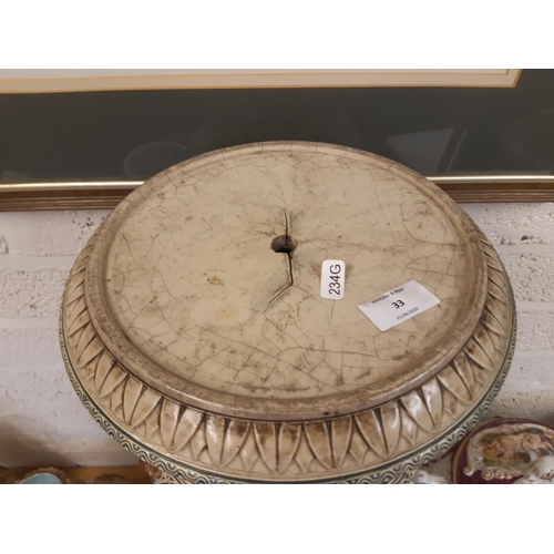 33 - A heavy stoneware salt glazed English Majolica jardinière stand with lion head acanthus leaf and swa... 