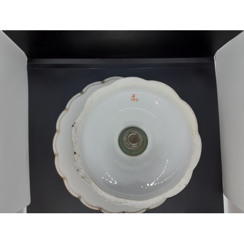 34 - An English porcelain table centrepiece with white ground and well detailed repeated gilded design wi... 