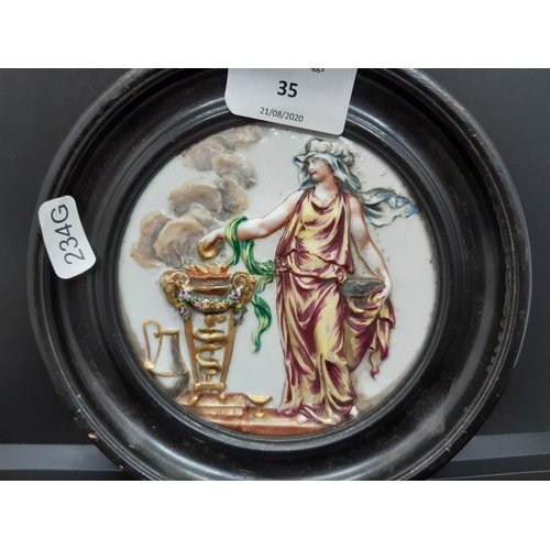 35 - Two 19th century Italian Polychrome Majolica circular relief plaques, one depicting Venus and Mars k... 