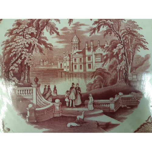37 - A Mason's Vista pattern pink transfer printed platter/charger with repeated board and central landsc... 