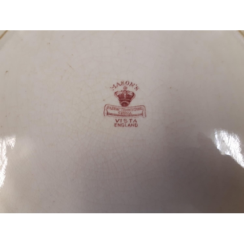 37 - A Mason's Vista pattern pink transfer printed platter/charger with repeated board and central landsc... 