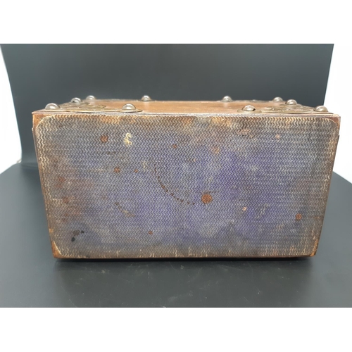 44 - A Victorian dome top figured walnut letter box with applied brass strap work with finely engraved mo... 