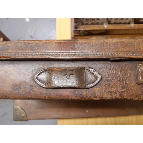 45 - A late 19th/early 20th century brown leather shotgun case, the exterior having heavy duty brass corn... 