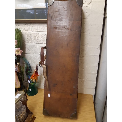 46 - A late 19th/early 20th century brown leather shotgun case, the exterior having heavy duty brass corn... 