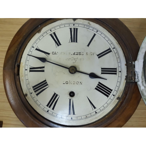 52 - A small Victorian walnut cased circular mechanical wall clock with off white enamel dial, Brass beze... 