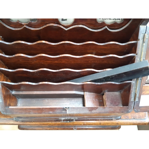 56 - An early 20th century oak stationary box / desk tidy with one lower drawer, pen holder, four section... 