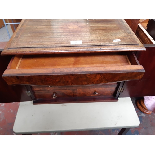 57 - A Victorian inlaid mahogany collectors cabinet with two doors and six drawers and one concealed draw... 