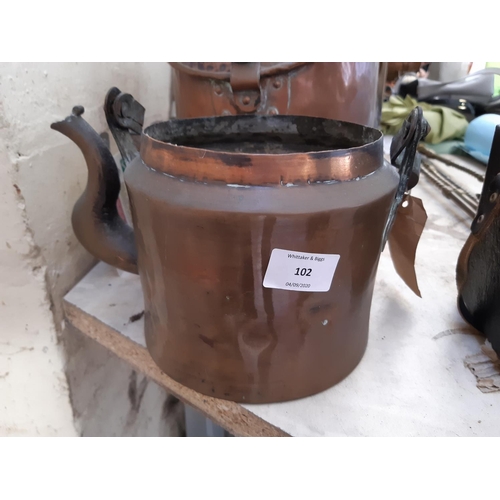 102 - A collection of mixed metalware to include a beaten copper kettle, copper coal scuttle, copper jug a... 