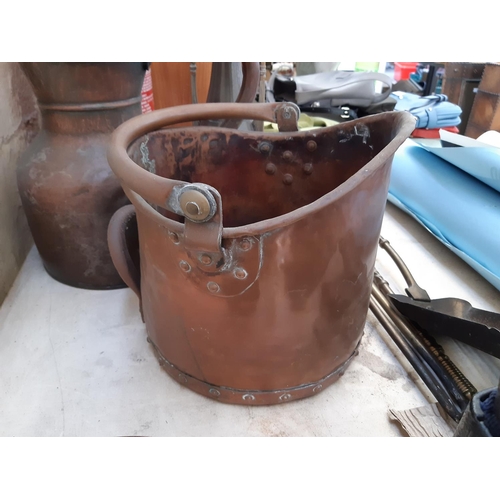 102 - A collection of mixed metalware to include a beaten copper kettle, copper coal scuttle, copper jug a... 