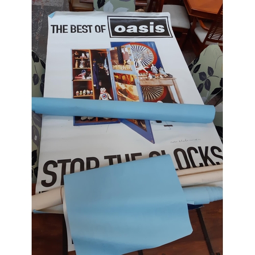 105 - A collection of various sized shop advertising Oasis posters