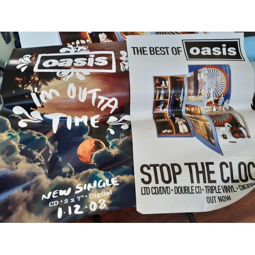 105 - A collection of various sized shop advertising Oasis posters