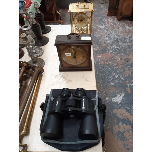 107 - Two vintage clocks to include a brass and glass cased Kundo style anniversary example and a Metamec ... 