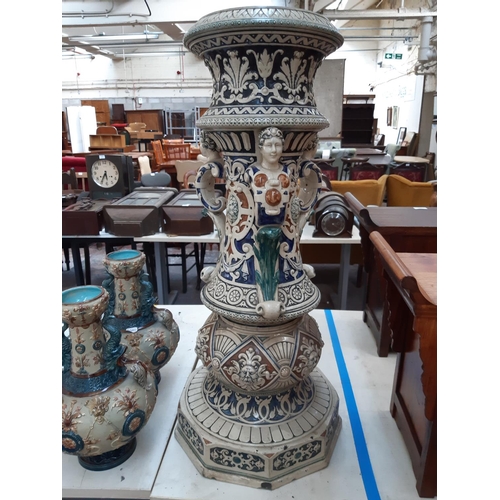 112 - A heavy stoneware salt glazed English Majolica jardinière stand with lion head acanthus leaf and swa... 