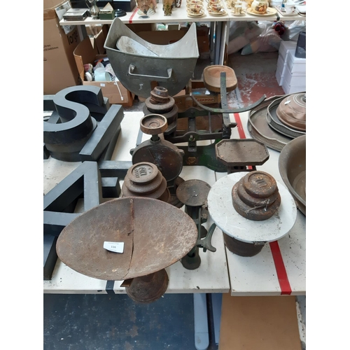 116 - Six vintage kitchen scales of various sizes together with a quantity of cast iron weights