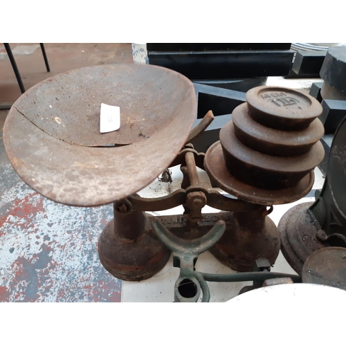 116 - Six vintage kitchen scales of various sizes together with a quantity of cast iron weights