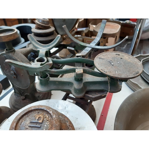 116 - Six vintage kitchen scales of various sizes together with a quantity of cast iron weights