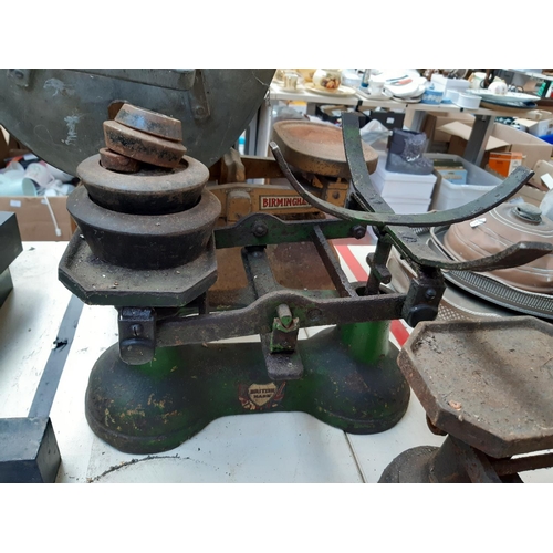 116 - Six vintage kitchen scales of various sizes together with a quantity of cast iron weights