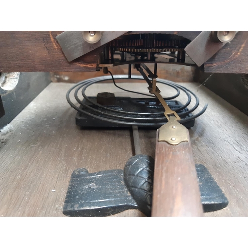 131 - Two vintage oak cased chiming wall clocks with silvered dials, both with keys and pendulums