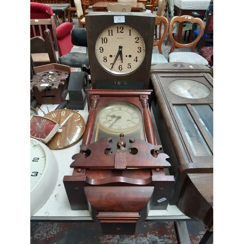 132 - Three various vintage wall clocks to include a Lincoln mahogany effect 31 day clock, Seiko 30 day cl... 