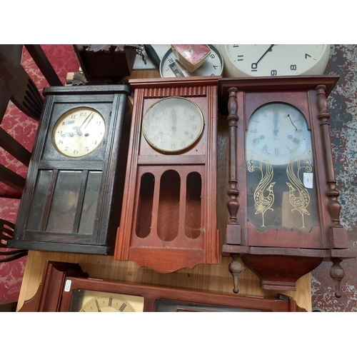 135 - Three vintage wall clocks to include an oak cased chiming clock and two mahogany effect 31 day chimi... 