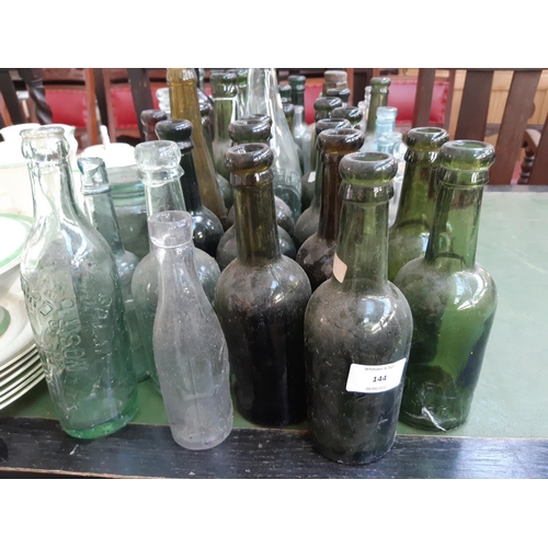 144 - A large collection of various vintage glass bottles to include ‘Dr Kilmer’s swamp root kidney, liver... 