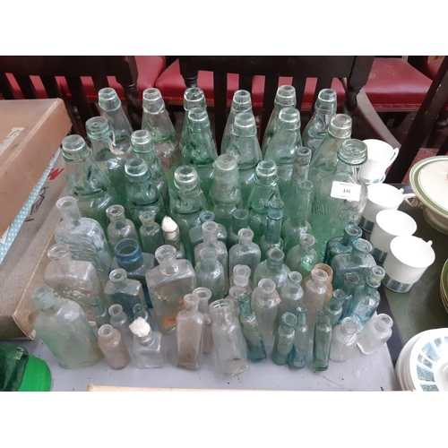 146 - A collection of vintage glass bottles to include apothecary bottles, ‘R. Stothert & Son‘ bottle, ‘Pa... 