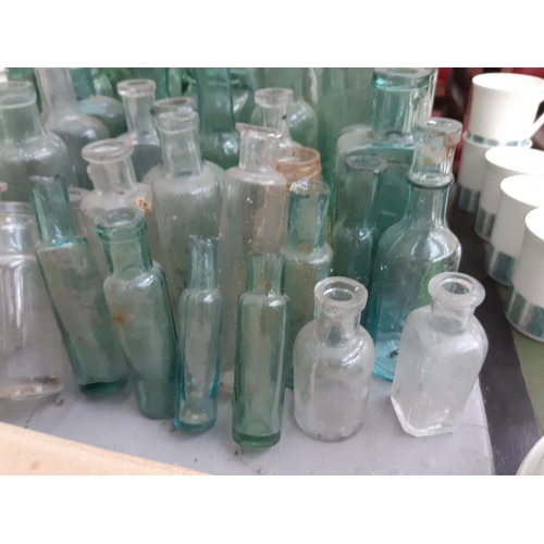 146 - A collection of vintage glass bottles to include apothecary bottles, ‘R. Stothert & Son‘ bottle, ‘Pa... 