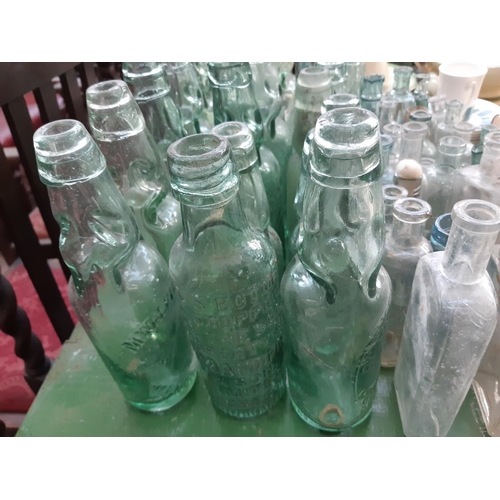 146 - A collection of vintage glass bottles to include apothecary bottles, ‘R. Stothert & Son‘ bottle, ‘Pa... 