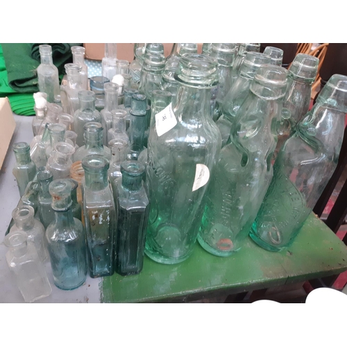 146 - A collection of vintage glass bottles to include apothecary bottles, ‘R. Stothert & Son‘ bottle, ‘Pa... 