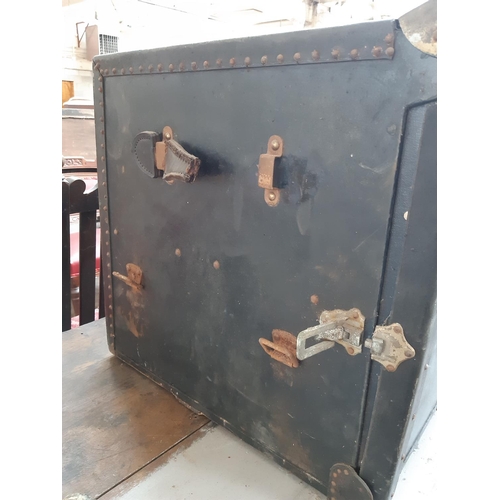 149 - A 1940s black canvas travel trunk with two concealed suitcases