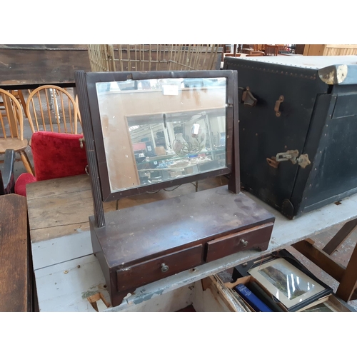 151 - A Georgian oak toilet mirror with two lower drawers