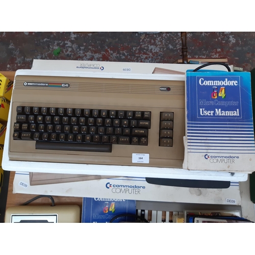 164 - A Commodore 64 micro computer with original box and manual