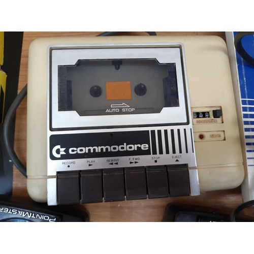 165 - A Commodore 64 Micro Computer together with joysticks, various games etc.