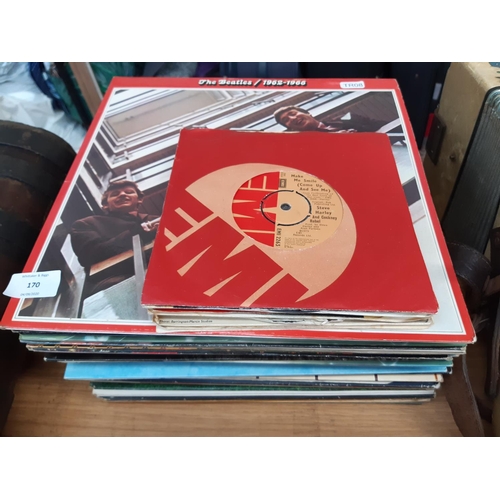 170 - A collection of both LP and 45 records to include ‘The Beatles/1962-1966’, ‘Pink Floyd - The Dark Si... 