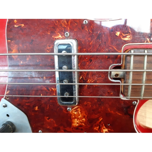 175 - An vintage red unbranded Fender jazz style model 1971 four string electric bass guitar with Tiesco p... 