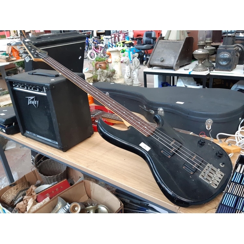 176 - A vintage black Aria pro II SB special II four string electric bass guitar together with a PB blazer... 