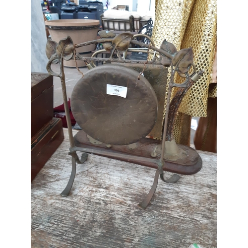 192 - Two vintage dinner gongs to include an Art Nouveau brass example with decorative leaf top and a late... 