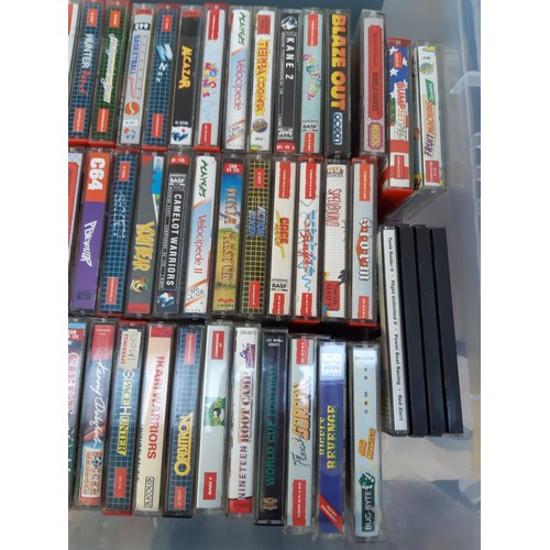 163A - A box containing a collection of Commodore 64 games to include ‘Night Racer’, ‘Ikari Warriors’, ‘Yog... 