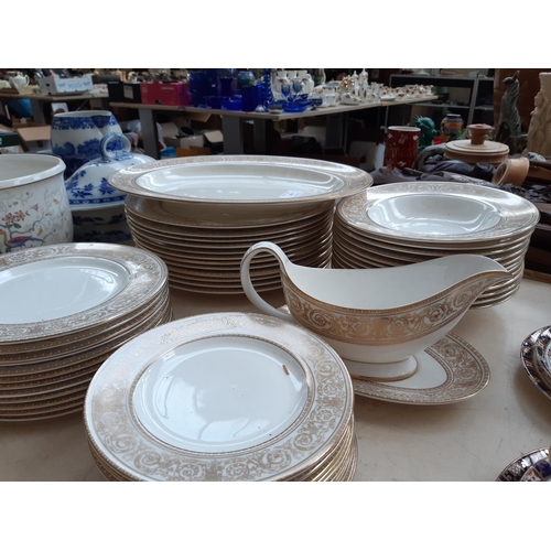 210 - A 53 piece Royal Doulton ‘Sovereign’ pattern part dinner service comprising two tureens, 12 side pla... 