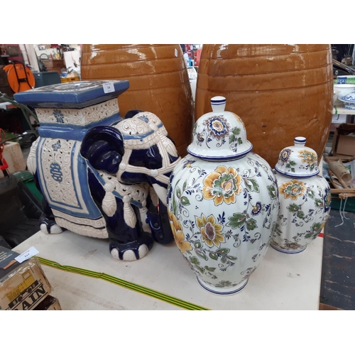 216 - Three items to include an oriental style ceramic blue and white elephant plant stand together with t... 