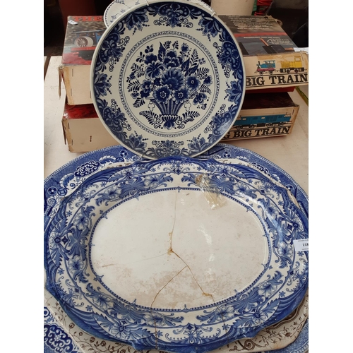 218 - A collection of blue and white china to include a Delft Blauw charger, large J. Meir & Son serving p... 