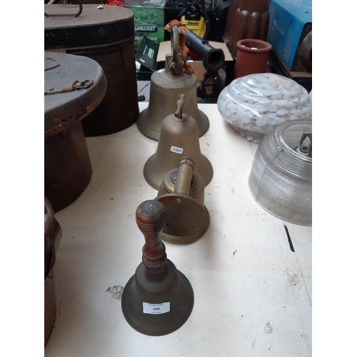 220 - A large vintage brass bell (missing ringer) together with two smaller brass bells and a Victorian br... 