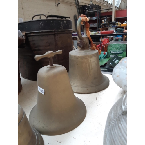 220 - A large vintage brass bell (missing ringer) together with two smaller brass bells and a Victorian br... 