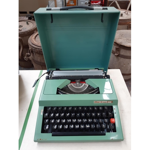 231 - A vintage green 1980’s Maritsa 30 plastic cased typewriter