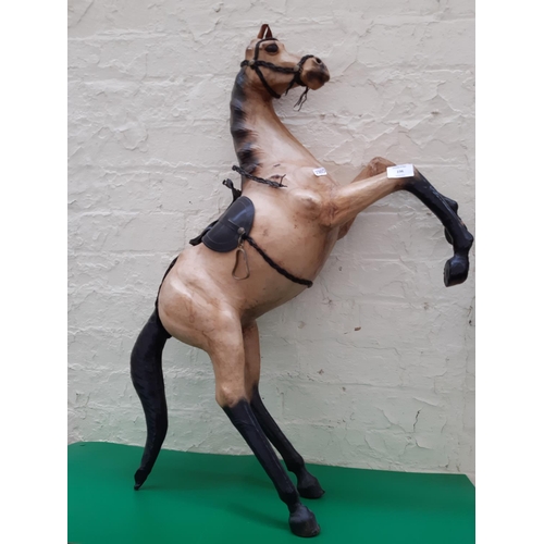 236 - A tall Liberty style rearing leather fireside horse model - measuring approx. 85cm and 57cm wide