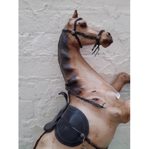 236 - A tall Liberty style rearing leather fireside horse model - measuring approx. 85cm and 57cm wide