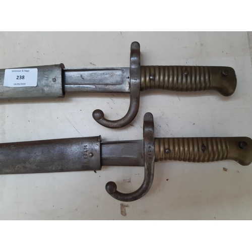 238 - Two French Chassepot bayonets with original scabbards, circa 1870, each having various inspectors an... 